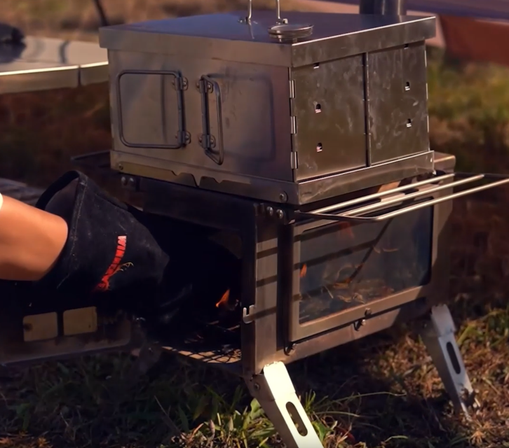 Video of Winnerwell® Flat Smoker: Shows setting up wood chips, placing the smoker on a stove, and smoking food (meats/veggies). Highlights its foldable design, 304 stainless steel durability, and ability to add smoky flavor to outdoor meals—perfect for camping, hiking, or off-grid cooking.