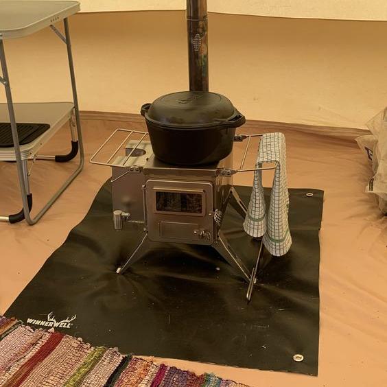 Winnerwell® Nomad 1G M - sized Cooktop Package in indoor use—demonstrates the complete kit set up for home camping or backyard testing. The foldable, space - saving design fits small areas, showcasing its versatility for both indoor demos and outdoor trips.