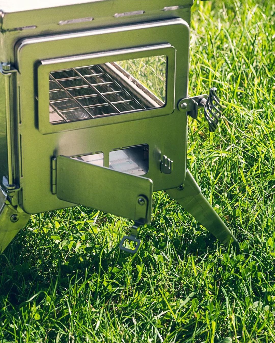 Camping stove Winnerwell Nomad View set up as stainless steel wood stove for hot tent camping in remote wilderness