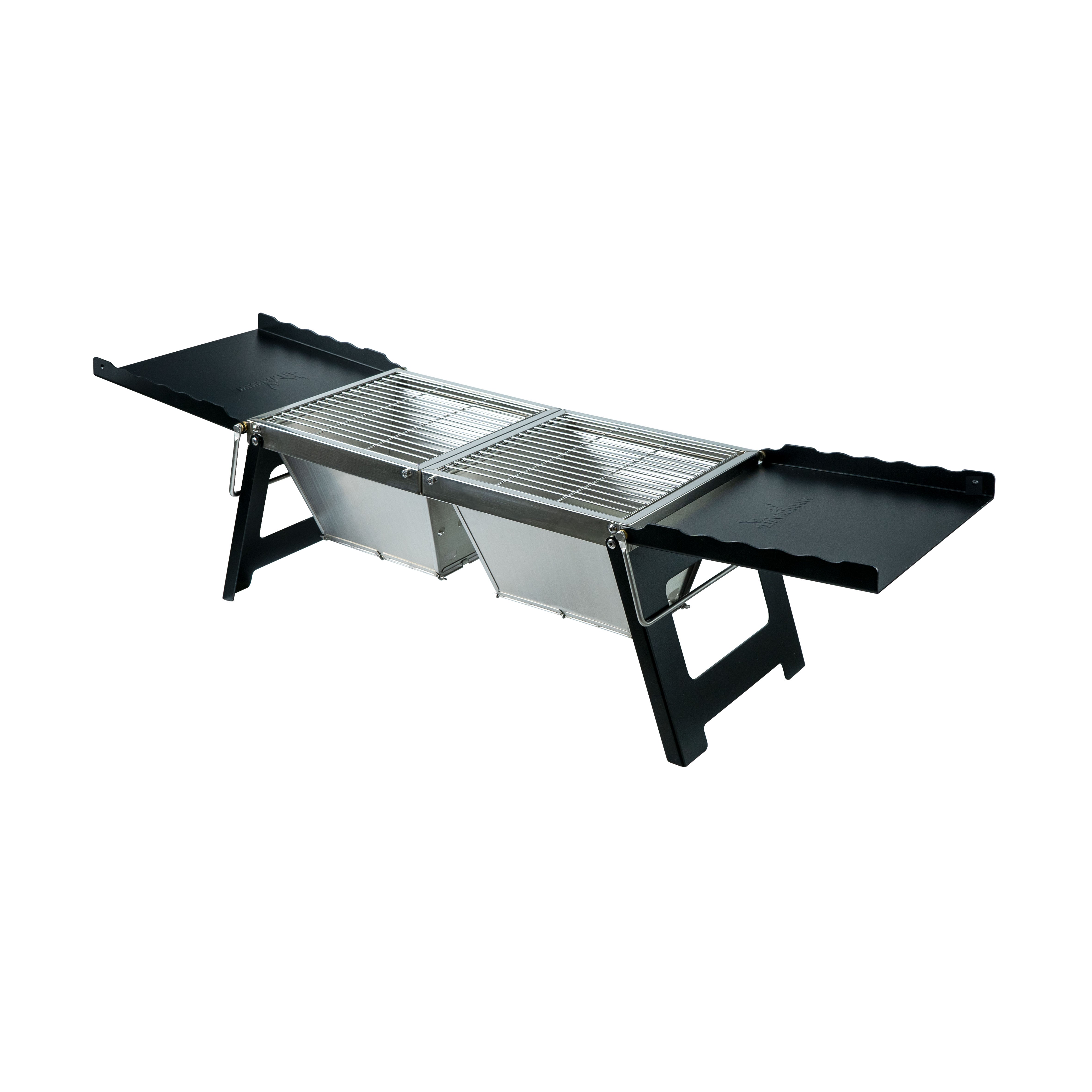 A fully - set - up Winnerwell® Fastfold Camp Table Charcoal BBQ Grill in a camping site, showing its 2 - in - 1 design as both a camp table and a charcoal grill for convenient outdoor cooking.